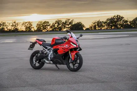 Red BMW F 450 RR sport bike on a paved track at sunset, featured in an 8K Ultra HD desktop wallpaper.