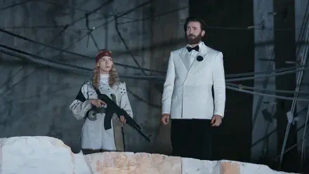 Anya Taylor-Joy with a rifle beside Chris Evans in a white suit in Sacrifice (2026), HD PC desktop wallpaper and background.