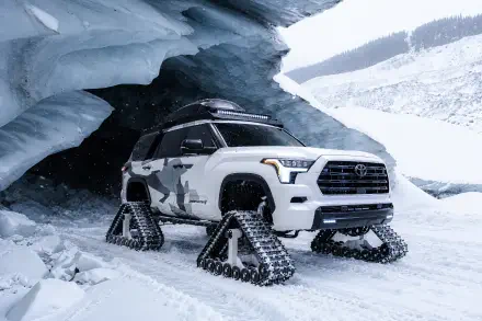 Toyota Sequoia Snowhunter with snow tracks beneath an icy overhang, shown in a 2K Quad HD PC desktop wallpaper.