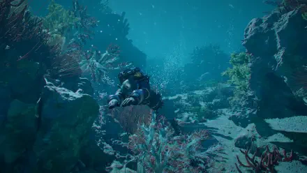 Crimson Desert HD PC desktop wallpaper of a scuba diver exploring a vivid underwater coral reef.