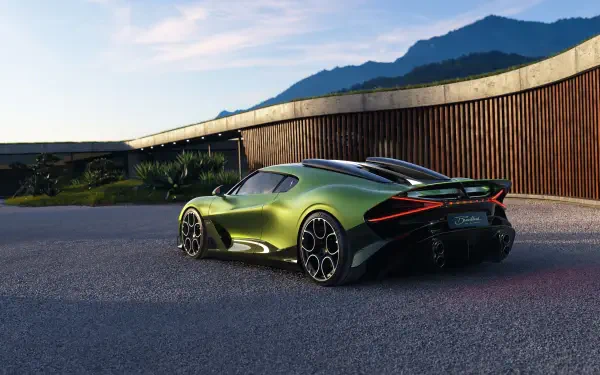 Green Bugatti Brouillard vehicle shown in rear three-quarter view by a modern house and distant mountains — 5K Ultra HD PC desktop wallpaper and background.