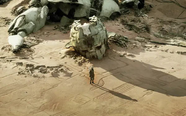 4K Ultra HD PC desktop wallpaper of the video game gen ATLAS: lone explorer stands beside a ruined robotic skull amid windswept desert dunes under a harsh sun.