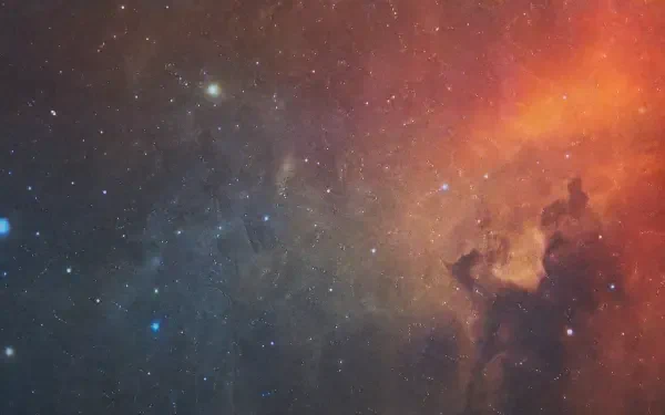 4K Ultra HD PC desktop wallpaper and background featuring cosmic dust: swirling blue and orange nebula clouds and scattered stars across a deep-space vista.