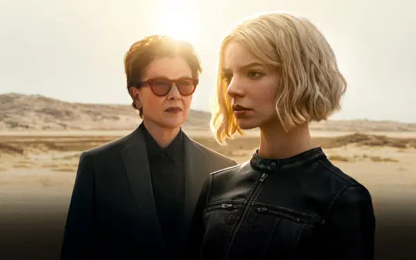 Lucky — 4K Ultra HD PC Desktop Wallpaper and Background: two stoic figures in black jackets stand in a sunlit desert, an older one with sunglasses behind a short blonde woman.