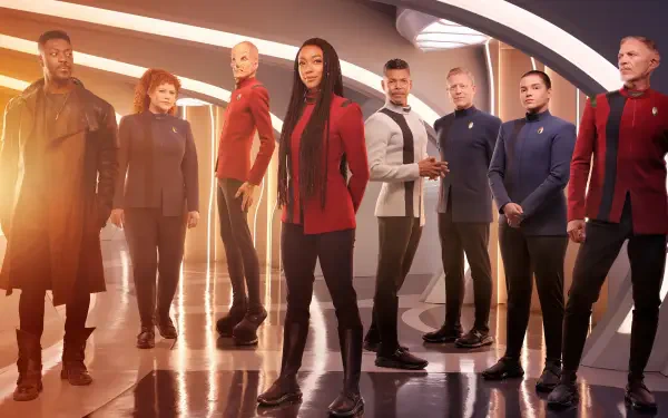 Star Trek: Discovery crew posed on a starship bridge, cinematic 4K Ultra HD PC desktop wallpaper with warm lighting, reflective deck and bold, dramatic composition.
