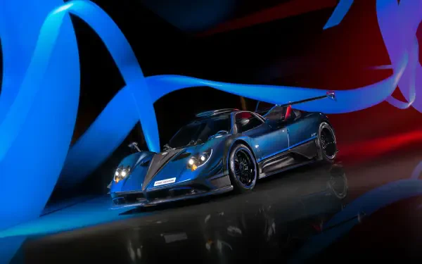 Blue Pagani Zonda racing car on a reflective floor, bathed in dynamic blue and red light ribbons — 4K Ultra HD PC desktop wallpaper and background.