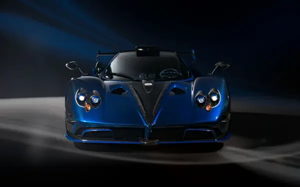 Blue Pagani Zonda racing car, front view on a dark, dramatic backdrop — 4K Ultra HD PC desktop wallpaper/background.