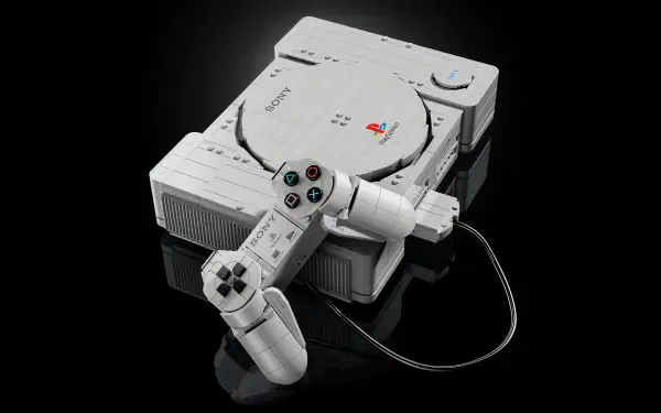 4K Ultra HD PC desktop wallpaper showing a LEGO-style PlayStation console with a wired controller on a black reflective background.