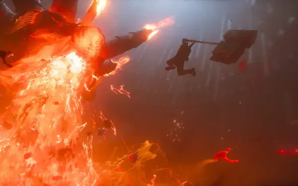 Control Resonant HD wallpaper: silhouetted figure swings through a massive explosion of fire and flame, tagged Dylan Faden.