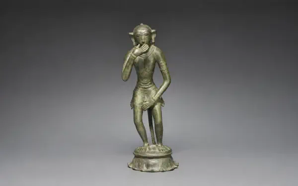 Bronze figurine statue of Lord Hanuman standing with one hand near his face on an ornate base, rendered as a 4K Ultra HD PC desktop wallpaper background.