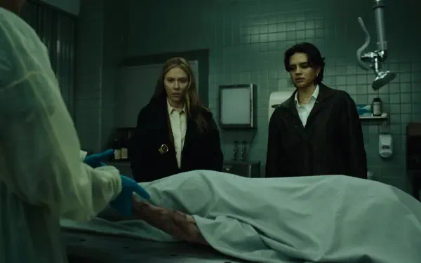 The Exorcist: Martyrs 2K Quad HD desktop wallpaper featuring Scarlett Johansson beside a covered corpse in a dim hospital morgue.