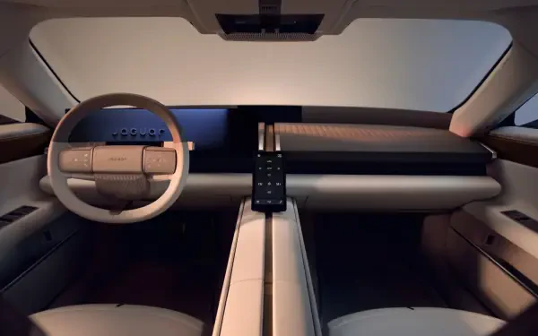 Jaguar Type 01 minimalist car interior with a sculpted dashboard and steering wheel, in 4K Ultra HD desktop wallpaper.