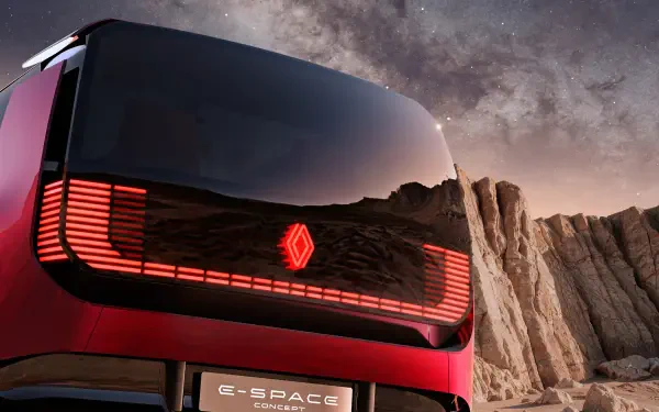 Renault E-Space concept car against a rocky landscape, featured in an HD desktop wallpaper background.