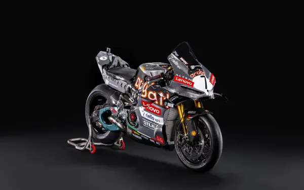 Ducati Panigale V4 R racing superbike on a dark studio background, featured in an 8K Ultra HD desktop wallpaper.