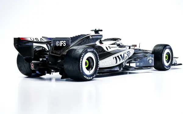 Cadillac MAC-26 F1 race car in a sleek studio render, featured in an 8K Ultra HD desktop wallpaper and background.