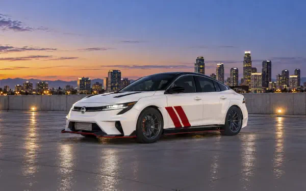 White Nissan Sentra Spec V Concept sedan by a city waterfront at sunset, 2K Quad HD PC desktop wallpaper and background.
