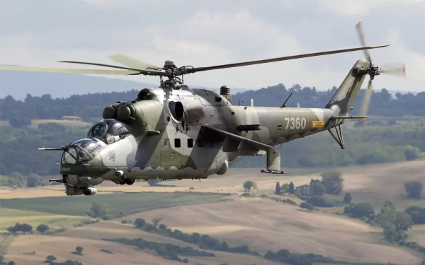 A Mil Mi-24 helicopter in flight, showcasing its military design against a backdrop of rolling hills, captured in stunning 4K Ultra HD detail.