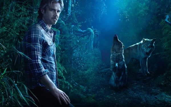 A captivating HD wallpaper from the TV show *True Blood*, featuring a man in a checkered shirt beside two wolves in a mysterious, moonlit forest setting.