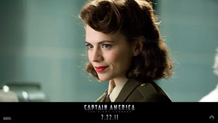 A stylish HD wallpaper featuring Hayley Atwell as Peggy Carter from the movie Captain America: The First Avenger, showcasing her iconic look in a vintage military uniform.