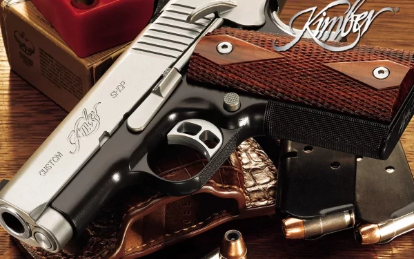 HD desktop wallpaper featuring a detailed close-up of a man-made Kimber pistol with wooden grips and nearby ammunition on a wooden surface.