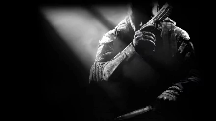 A shadowy warrior holds a gun, embodying the intense atmosphere of Call of Duty: Black Ops II in this HD desktop wallpaper. The image captures the grit and action of the game.