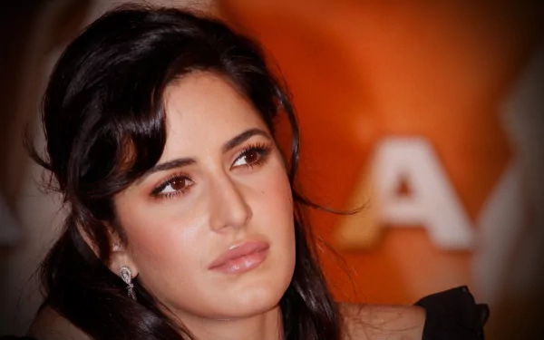 HD desktop wallpaper of Indian actress and celebrity Katrina Kaif, featuring a close-up shot with a warm, orange background.