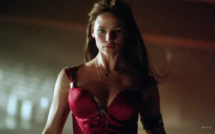 HD PC desktop wallpaper featuring celebrity Jennifer Garner in a dramatic, dark-toned scene wearing a red outfit.