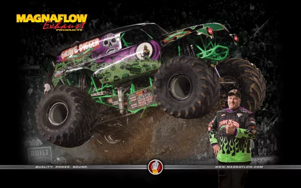 HD desktop wallpaper featuring the Grave Digger monster truck driven by Dennis Anderson, with its vibrant green and black design front and center.