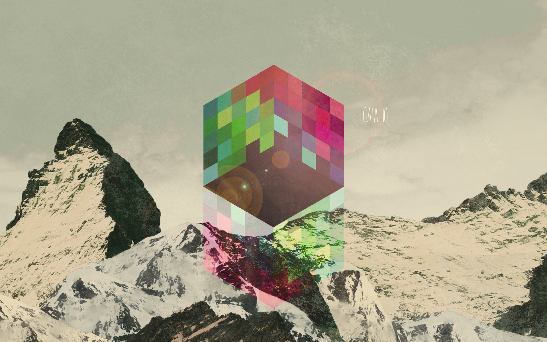 Abstract and cool HD PC desktop wallpaper featuring a colorful pixelated cube floating above snowy mountain peaks under a muted sky.