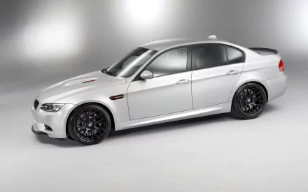 Silver BMW M3 CTR compact sedan shown in studio lighting, 2K Quad HD PC desktop wallpaper/background.