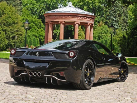 Black Ferrari sports car on a cobblestone driveway in front of a neoclassical pavilion — HD PC desktop wallpaper and background.