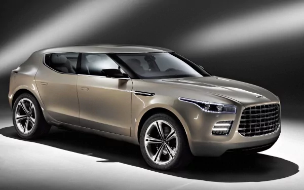 Metallic-beige Aston Martin Lagonda SUV concept under dramatic studio lighting, presented as an HD PC desktop wallpaper and background.