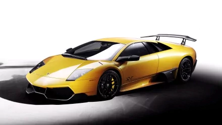 HD PC desktop wallpaper featuring a sleek yellow Lamborghini Murcielago sports car against a white background.