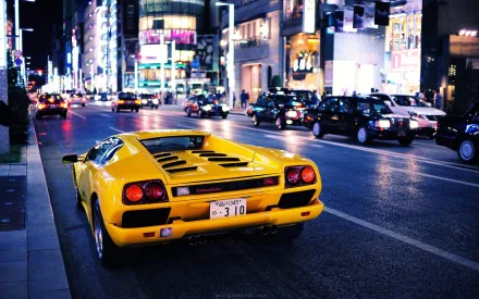 Yellow Lamborghini Diablo vehicle on a neon-lit city street at night — HD PC desktop wallpaper/background.
