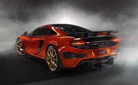 HD PC desktop wallpaper featuring a sleek red McLaren vehicle with gold rims, captured from a rear three-quarter view against a smoky gray background.