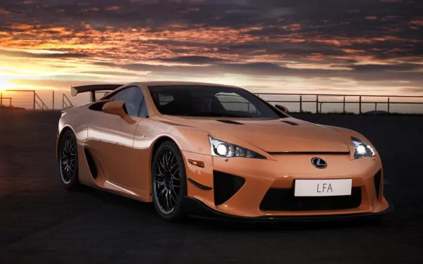 Orange Lexus LFA Nurburgring Edition sports vehicle at sunset on the track — HD PC desktop wallpaper/background.