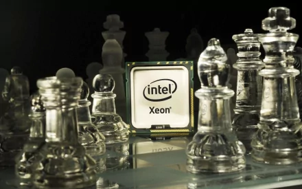 A sleek Intel Xeon processor positioned among glass chess pieces, symbolizing the intersection of technology and strategy in a high-definition desktop wallpaper.