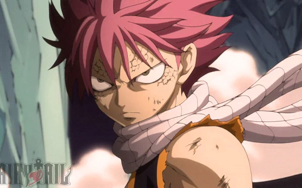 HD desktop wallpaper featuring Natsu Dragneel from the anime Fairy Tail, showcasing his intense expression with his trademark pink hair and white scarf.