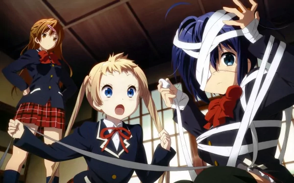 Three anime characters from Love, Chunibyo & Other Delusions are depicted: Sanae Dekomori, Shinka Nibutani, and Rikka Takanashi, with Rikka humorously tangled in ribbons.