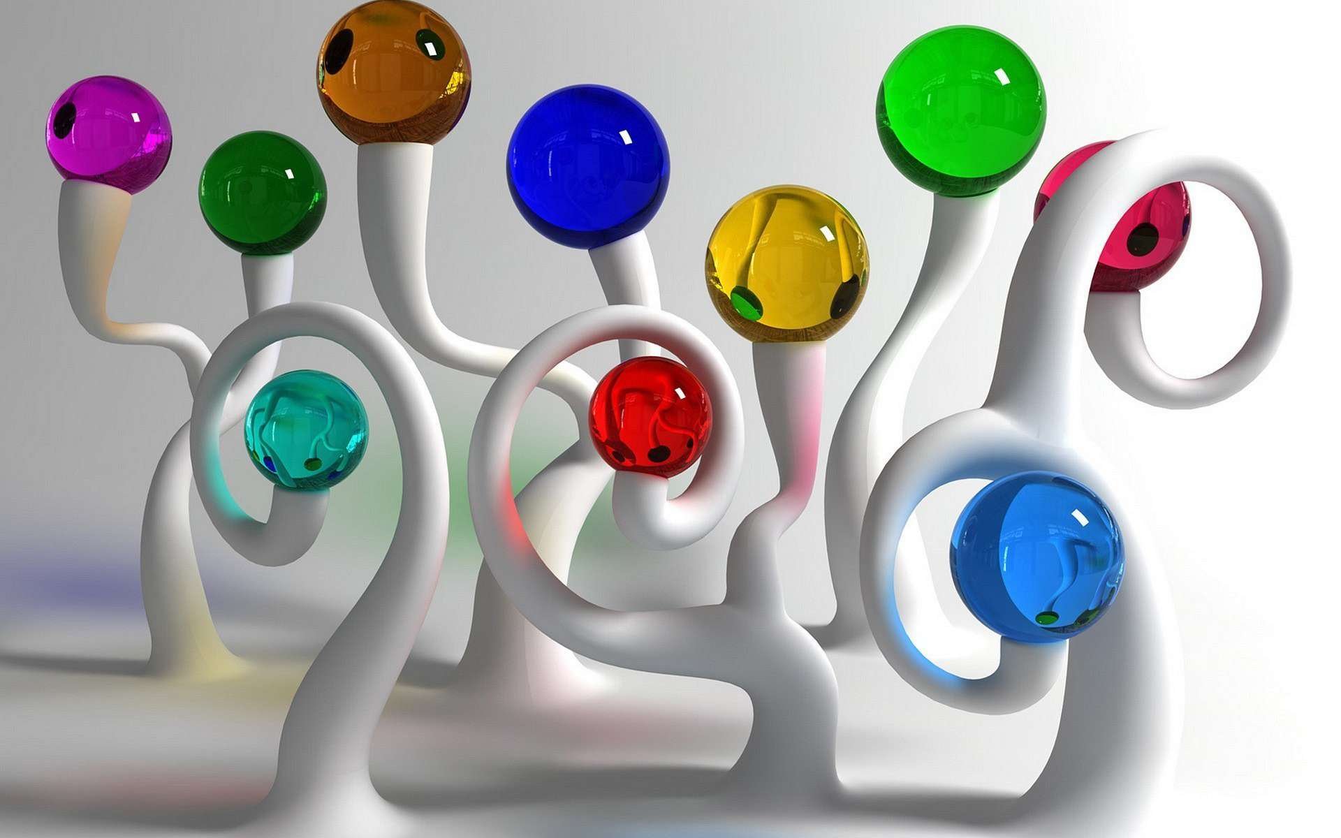An abstract artistic design featuring white, swirling forms topped with colorful, glossy spheres. This HD desktop wallpaper adds a vibrant touch to any background.