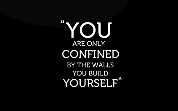A motivational HD desktop wallpaper featuring the quote, You are only confined by the walls you build yourself, on a black background.