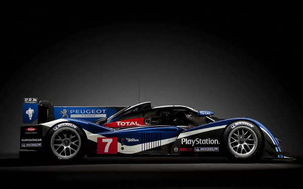 HD PC desktop wallpaper featuring a sleek Peugeot race car in black, blue, and white with prominent sponsor logos and the number 7 on the side.
