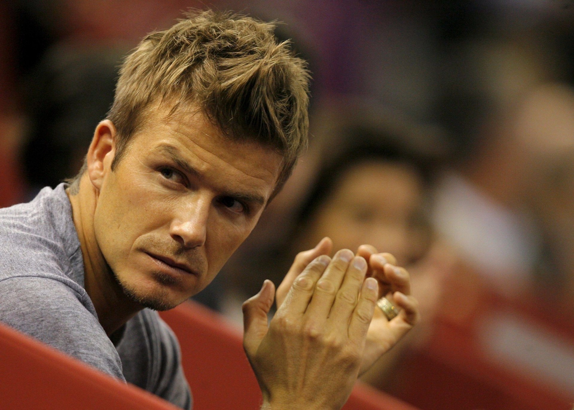 David Beckham, a prominent figure in sports, is captured in this HD desktop wallpaper, showcasing a contemplative moment during a game.