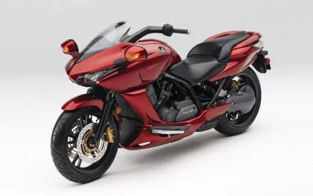 HD desktop wallpaper featuring a red Honda DN-D1 motorcycle, showcasing its sleek design and distinctive styling as a standout Honda vehicle.