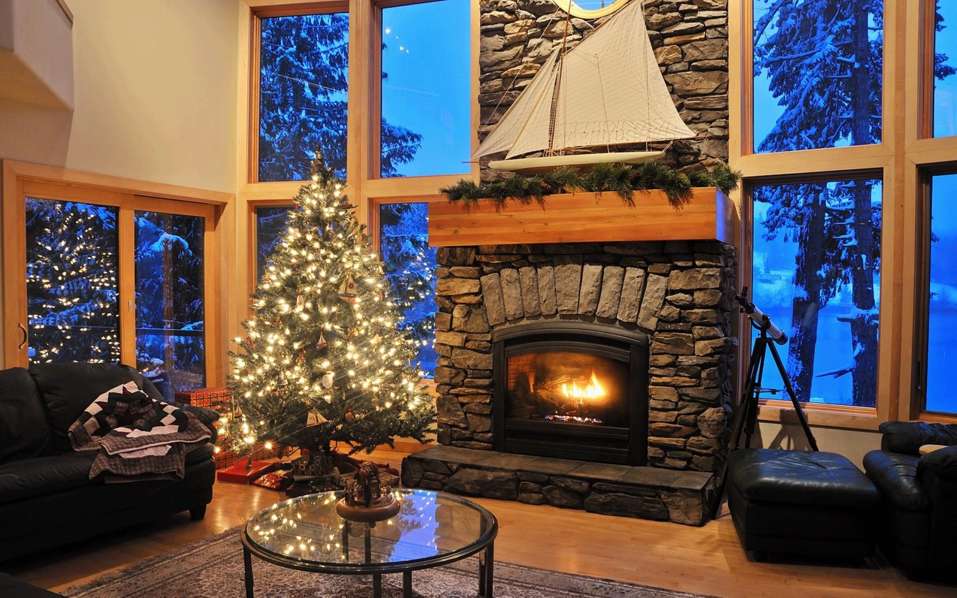 A cozy living room features a stone fireplace with a glowing fire, a beautifully lit Christmas tree, and festive decorations, all set against a wintery backdrop. Perfect holiday ambiance.