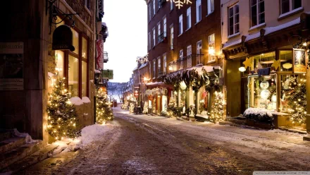 HD desktop wallpaper featuring a picturesque street adorned with Christmas lights, festive trees, and holiday decorations, creating a warm and inviting holiday scene.