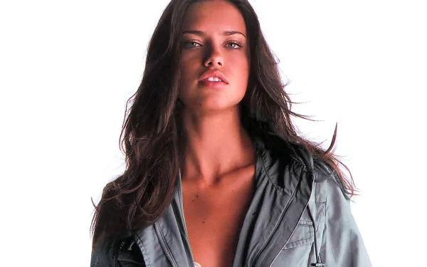HD wallpaper featuring celebrity Adriana Lima, showcasing her confident pose and stunning features against a clean white background.