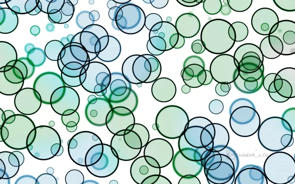 An abstract HD wallpaper featuring a playful arrangement of multicolored bubbles in shades of blue and green against a white background, creating a vibrant and dynamic visual effect.