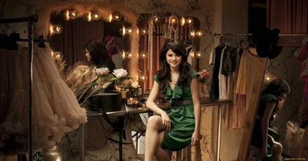A glamorous Selena Gomez poses in a stylish green dress, surrounded by soft lighting and chic fashion elements, creating an enchanting HD wallpaper backdrop celebrating her music career.