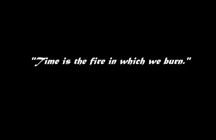 HD PC desktop wallpaper featuring a black background with the white Star Trek Generations movie quote, Time is the fire in which we burn.